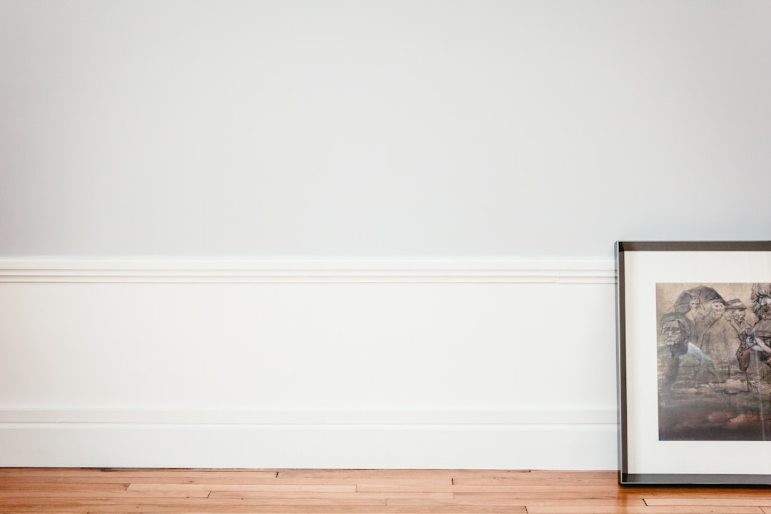 Framed Art next to a white wall in a french apartment.